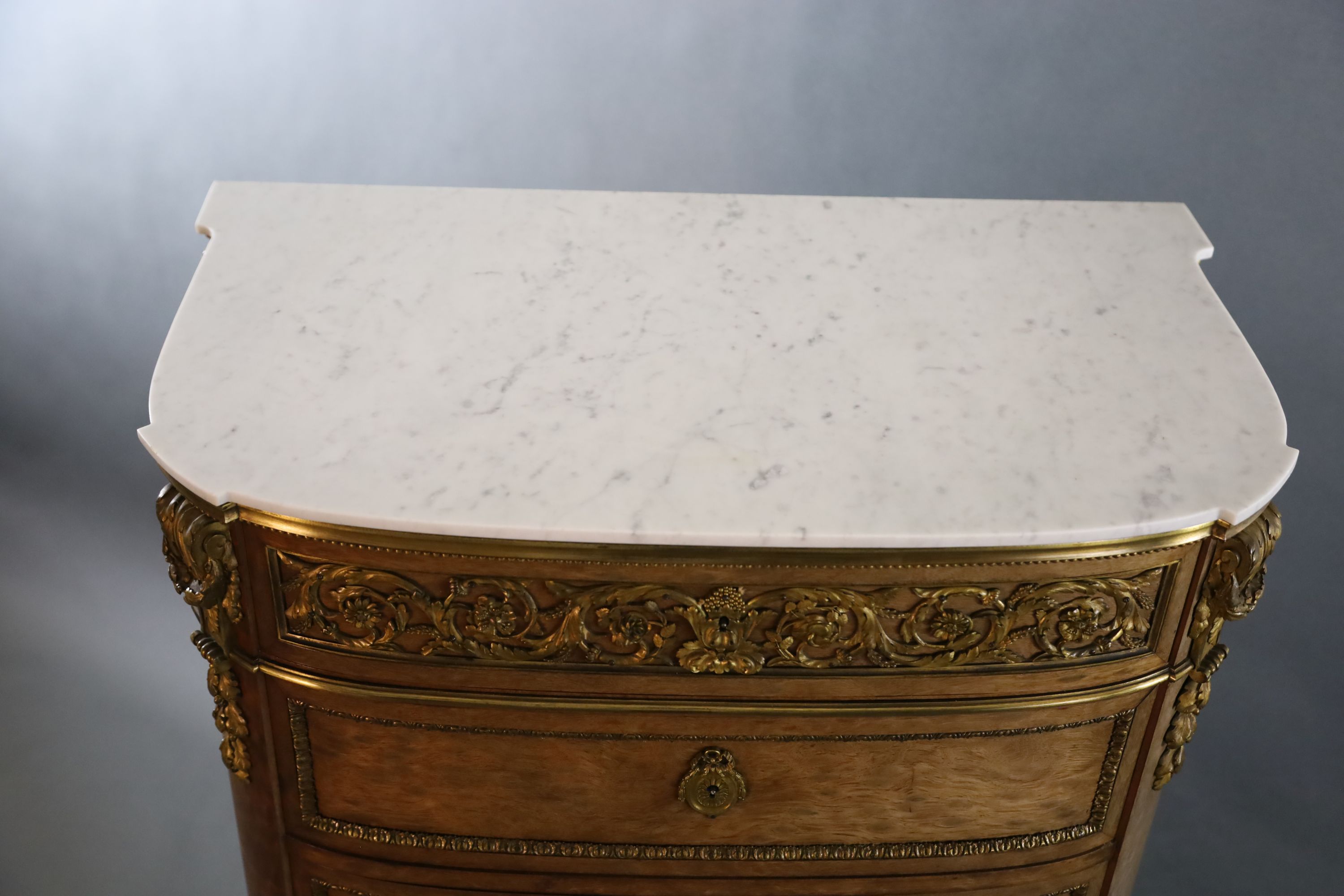 A Louis XVI style ormolu mounted mahogany semanier, W.2ft 7.5in. D.1ft 6.5in. H.4ft 7.5in.